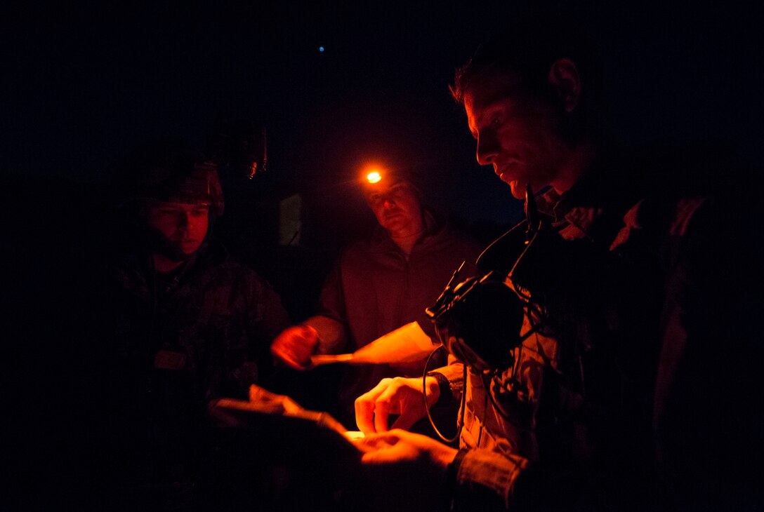 Tech. Sgt. Jeremy Rarang, Senior Airman Tormod Lillekroken, 2nd Air Support Operations Squadron joint terminal attack controllers, and Master Bombardier Mathiew Marcoux-Desrochers, a joint terminal attack controller from the Yankee Battery of the 2nd Regiment, Royal Canadian Horse Artillery, discuss training objectives as part of a night training scenario during Exercise Serpentex ‘16 in Corsica, France, March 15, 2016. Lillekroken grew up in Stange, Norway, and left to live in America when he was 20 years old. He joined the U.S. Air Force three years later to become a part of the tactical air control party career field. (U.S. Air Force photo/Staff Sgt. Sara Keller)