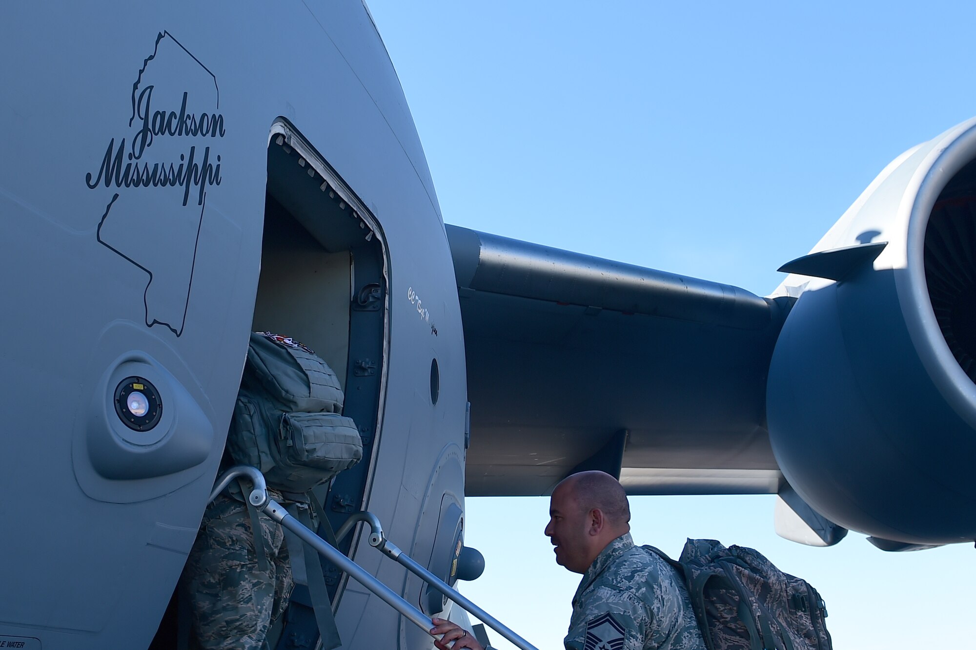 Members of the 140th Wing board a C-17 Globemaster III March 16, 2015, on Buckley Air Force Base, Colo. The 140th Wing transported Airmen and some equipment to Tyndall AFB, Florida, to participate in an Air-to-Air Weapons Engagement Program exercise. (U.S. Air Force photo by Airman 1st Class Luke W. Nowakowski/Released)