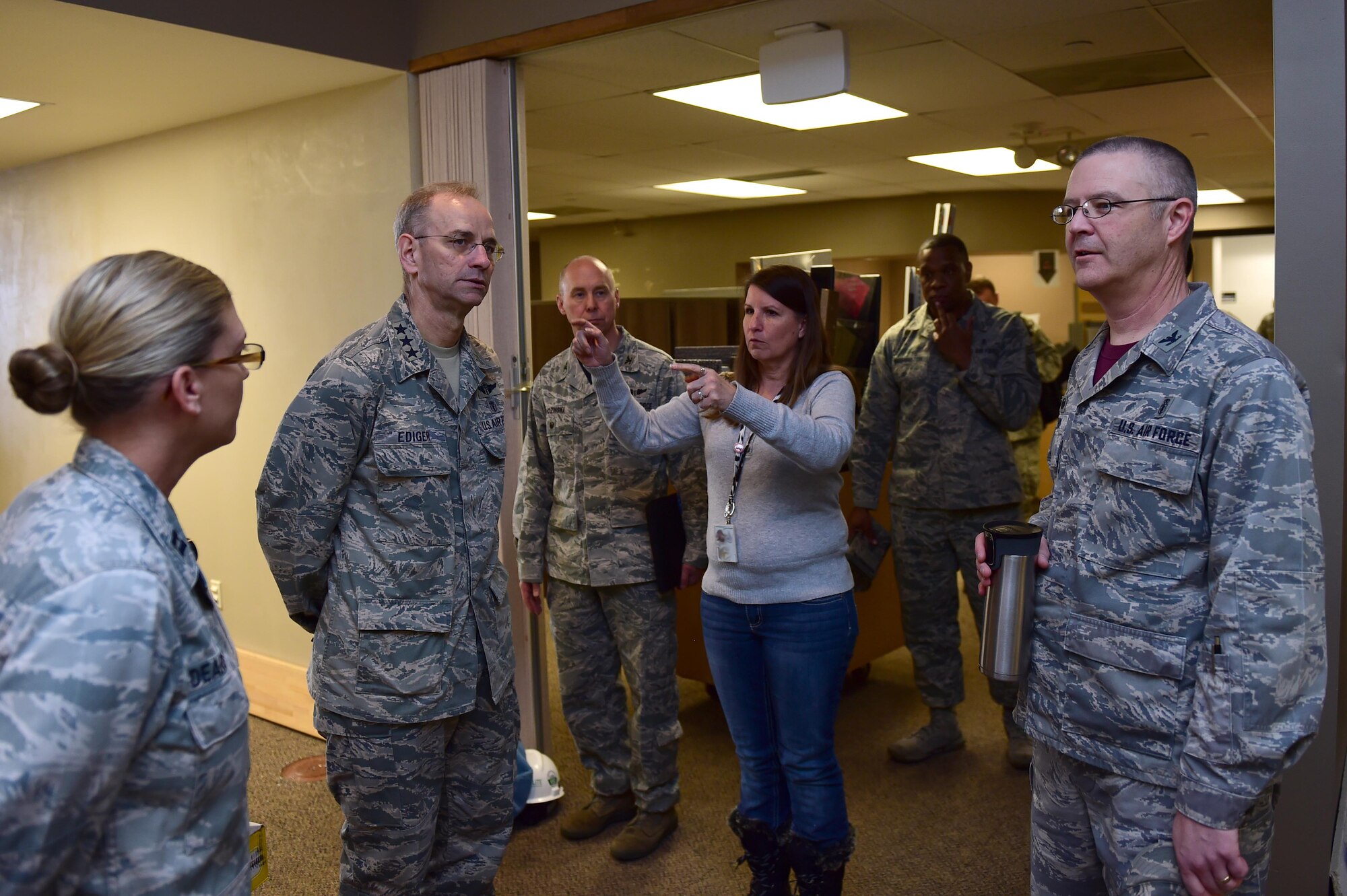 Lt. Gen. (Dr.) Mark A. Ediger, Surgeon General of the Air Force, learns about the construction in the 460th Medical Group March 18, 2016, from Air Force Space Command and the 460th Medical Group leadership on Buckley Air Force Base, Colo. Medical facilities on base are currently under renovation to ensure easier healthcare accessibility for military members and their families. (U.S. Air Force photo by Airman 1st Class Gabrielle Spradling/Released)