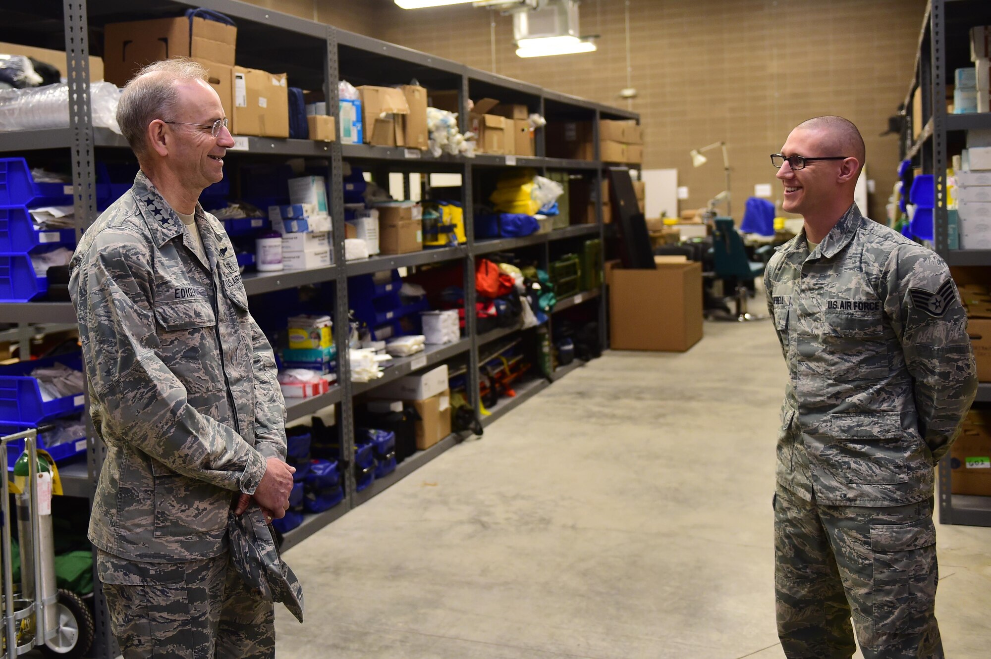 Lt. Gen. (Dr.) Mark A. Ediger, Surgeon General of the Air Force, tours the 460th Medical Group warehouse with Staff Sgt. Michael Campbell, medical warehouse non-commissioned officer in charge, March 18, 2016, on Buckley Air Force Base, Colo. Ediger’s visit included tours of medical facilities both on and off base, to see the progression of the changes to the 460th MDG. (U.S. Air Force photo by Airman 1st Class Gabrielle Spradling/Released)