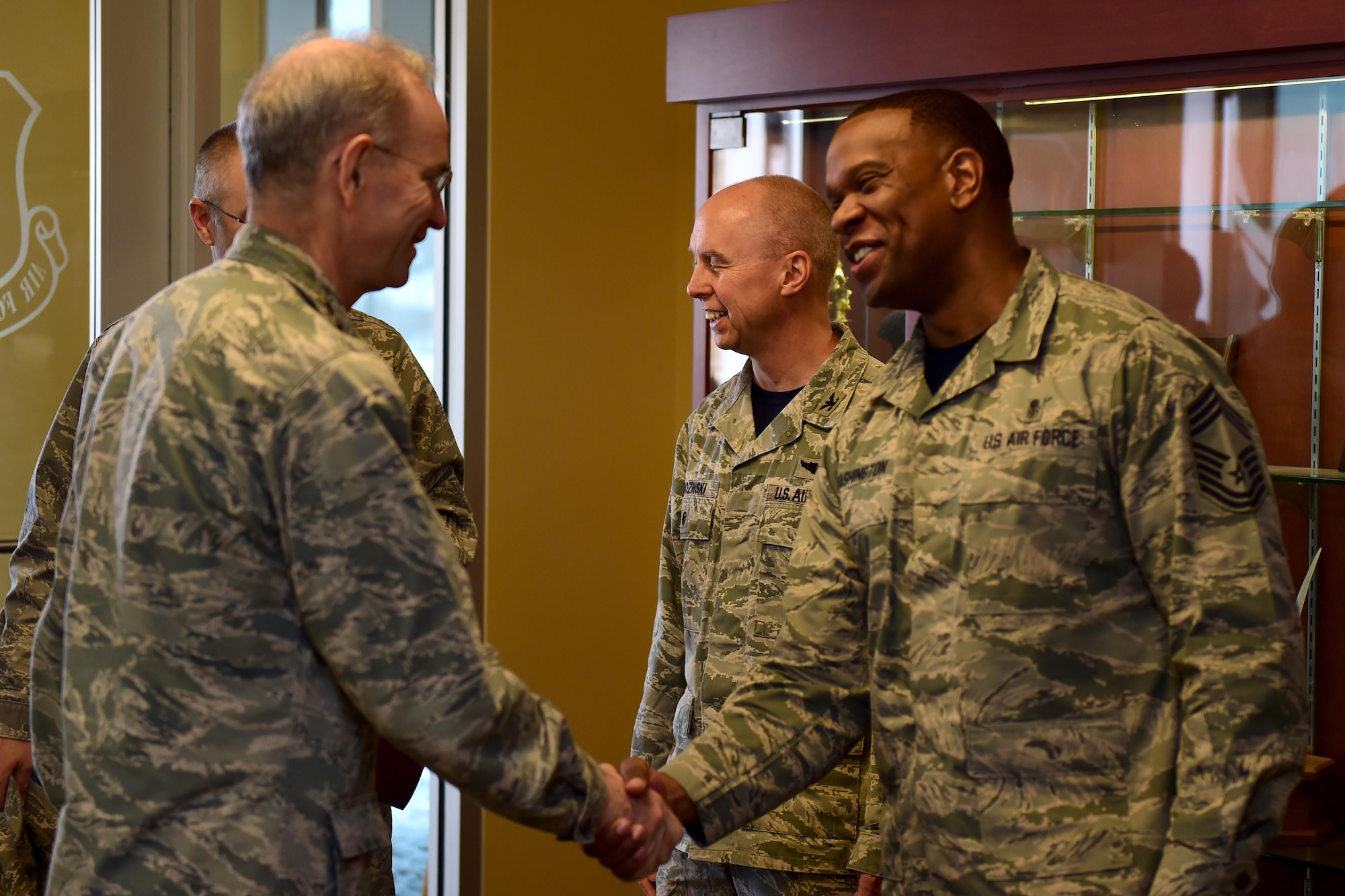 Chief Master Sgt. Tracy Washington, 779th Medical Group superintendent, greets Lt. Gen. (Dr.) Mark A. Ediger, Surgeon General of the Air Force, March 18, 2016, during his visit to Buckley Air Force Base, Colo. Ediger’s visit included a tour of the medical facilities and a briefing regarding the changes happening within the 460th Medical Group. (U.S. Air Force photo by Airman 1st Class Gabrielle Spradling/Released)
