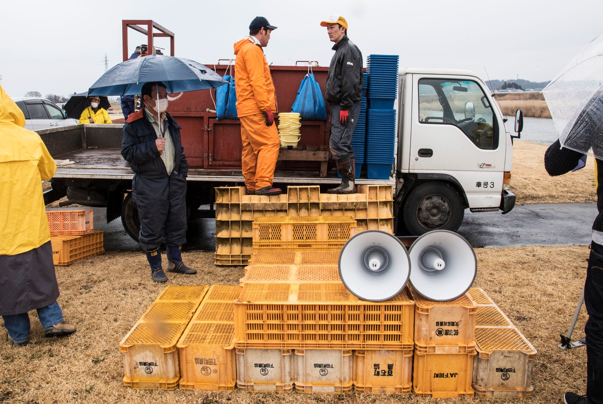 Baby salmon release staff prepare to move the fish to buckets at the Oirase Salmon Park, Japan, March 19, 2016. More than 400,000 young fish were released into the Oirase River by Misawa Air Base and local Japanese volunteers during the 19th Annual Baby Salmon Release. (U.S. Air Force photo by Airman 1st Class Jordyn Fetter)
