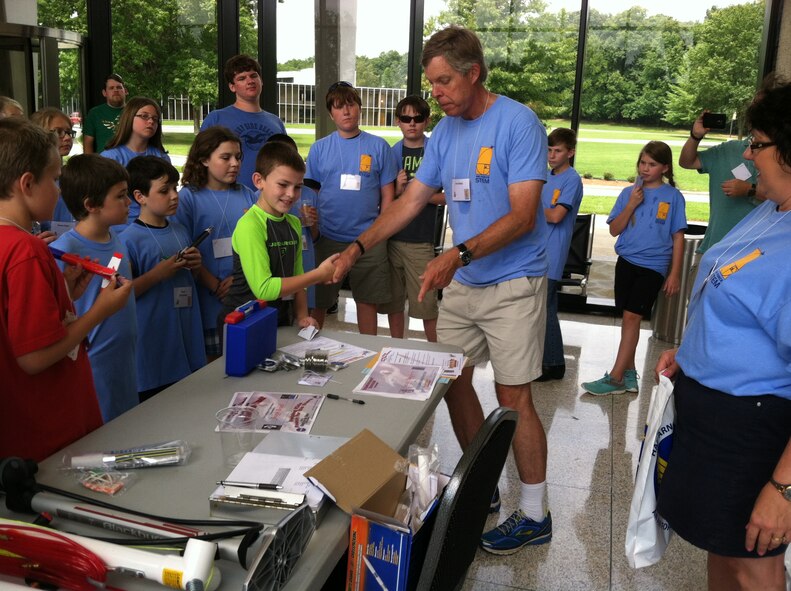 Jere Matty, director of the AEDC STEM Program, congratulates Samuel Mansfield, left, on winning the local Reach for the Stars Rocket Competition. The competition was held August 2015 at the University of Tennessee Space Institute. (Courtesy photo)