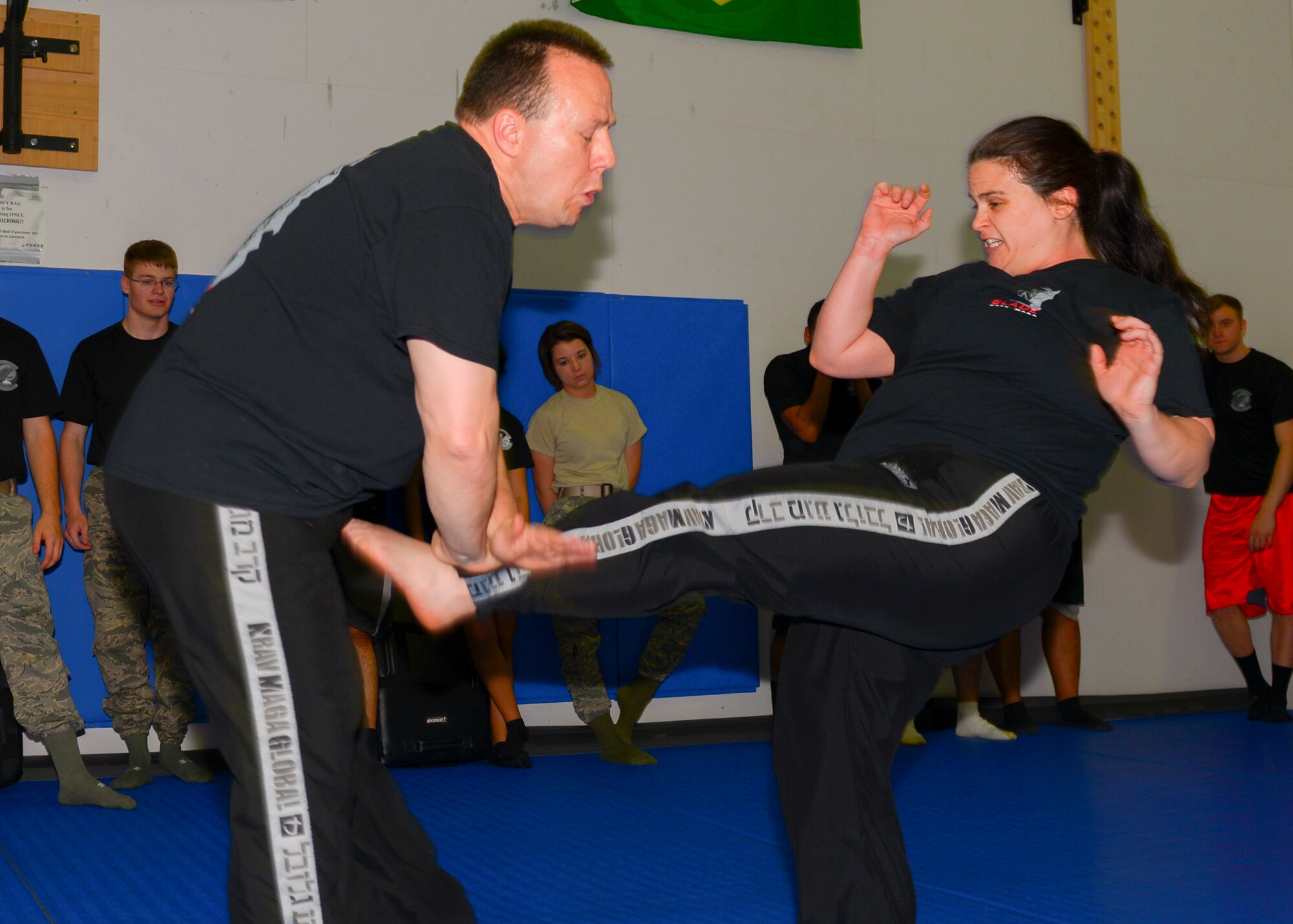 Eugene and Dita Bailey, Samurai Fitness Center Krav Maga instructors, demonstrate Krav Maga techniques at Yokota Air Base, Japan, March 18, 2016. According to Dita Bailey, Krav Maga is a self-defense system based on natural, practical and intuitive responses which anyone can learn easily. (U.S. Air Force photo by Airman 1st Class Baker/Released)