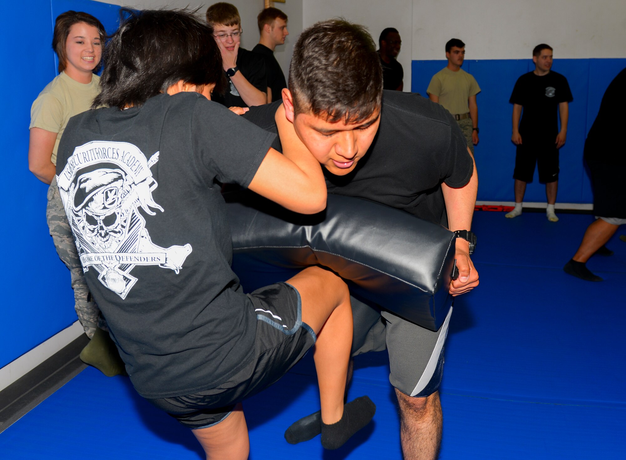 Students practice Krav Maga techniques at Yokota Air Base, Japan, March 18, 2016. The class is aimed to provide defensive fighting techniques to anyone who could be exposed to hostile situations in the course of duty or every-day life. (U.S. Air Force photo by Airman 1st Class Baker/Released)