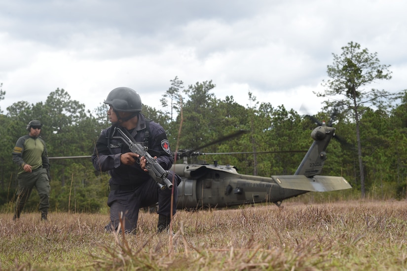 Combat Nurses, safeguard the loading of a U.S. Army UH-60 Black Hawk helicopter during a personnel recovery exercise, March 10, 2016, near Soto Cano Air Base, Honduras. During this exercise U.S. medical, rescue and aviation assets and Honduran combat medical forces joined together to validate their ability to respond to a simulated downed aircraft in a remote area. (U.S. Army photo by Martin Chahin/Released)