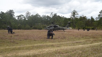 Combat Nurses, safeguard the loading of a U.S. Army UH-60 Black Hawk helicopter during a personnel recovery exercise, March 10, 2016, near Soto Cano Air Base, Honduras. During this exercise U.S. medical, rescue and aviation assets and Honduran combat medical forces joined together to validate their ability to respond to a simulated downed aircraft in a remote area. (U.S. Army photo by Martin Chahin/Released)