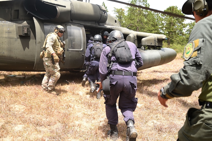 Honduran Combat Nurses stand by for instructions during a personnel recovery exercise with U.S. partners from Joint Task Force-Bravo, March 10, 2016 near Soto Cano Air Base, Honduras. During this exercise, the Hondurans integrated with U.S. Servicemembers, providing security to the site while U.S. firefighters and medical personnel practiced recovering simulated victims from a mock helicopter crash. (U.S. Army photo by Martin Chahin/Released) 