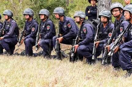 Honduran Combat Nurses stand by for instructions during a personnel recovery exercise with U.S. partners from Joint Task Force-Bravo, March 10, 2016 near Soto Cano Air Base, Honduras. During this exercise, the Hondurans integrated with U.S. Servicemembers, providing security to the site while U.S. firefighters and medical personnel practiced recovering simulated victims from a mock helicopter crash. (U.S. Army photo by Martin Chahin/Released) 