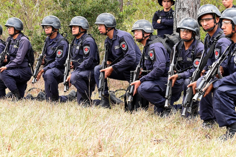 Honduran Combat Nurses stand by for instructions during a personnel recovery exercise with U.S. partners from Joint Task Force-Bravo, March 10, 2016 near Soto Cano Air Base, Honduras. During this exercise, the Hondurans integrated with U.S. Servicemembers, providing security to the site while U.S. firefighters and medical personnel practiced recovering simulated victims from a mock helicopter crash. (U.S. Army photo by Martin Chahin/Released) 