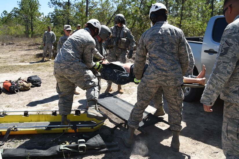 Airmen from Joint Task Force-Bravo 612th Air Base Squadron Fire Department practice loading a simulated crash victim onto a U.S. Army UH-60 Black Hawk helicopter during a personnel recovery exercise, March 10, 2016, near Soto Cano Air Base, Honduras. This was the first participation of firefighters during JTF-Bravo’s quarterly personnel rescue practices, testing their abilities to respond to this type of mission. (U.S. Army photo by Martin Chahin/Released)