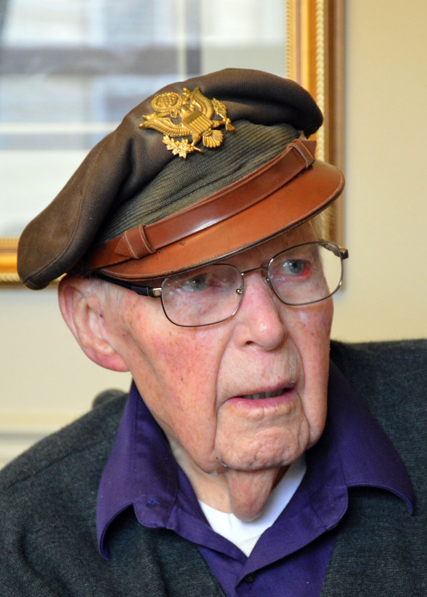 Retired World War II navigator Lt. Col. Leonard Erickson discusses his military service with 120th Airlift Wing Chaplain, Lt. Col. Arthur McCaffrey, at an assisted living facility in Butte, Mont., March 10, 2016. Erickson served as a navigator for DH 98 Mosquito and B-17 Flying Fortresses during the war. (U.S. Air National Guard photo by Senior Master Sgt. Eric Peterson) (U.S. Air National Guard photo by Senior Master Sgt. Eric Peterson/Released)