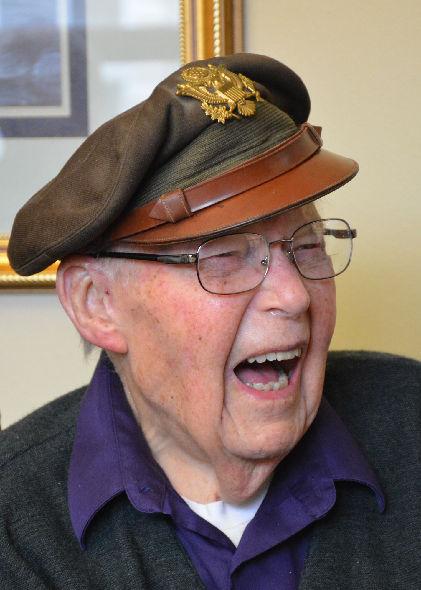 Retired World War II navigator Lt. Col. Leonard Erickson shares a humorous story during a visit with 120th Airlift Wing Chaplain, Lt. Col. Arthur McCaffrey, at an assisted living facility in Butte, Mont., March 10, 2016. Erickson served as a navigator for DH 98 Mosquito and B-17 Flying Fortresses during the war. (U.S. Air National Guard photo by Senior Master Sgt. Eric Peterson/Released)
