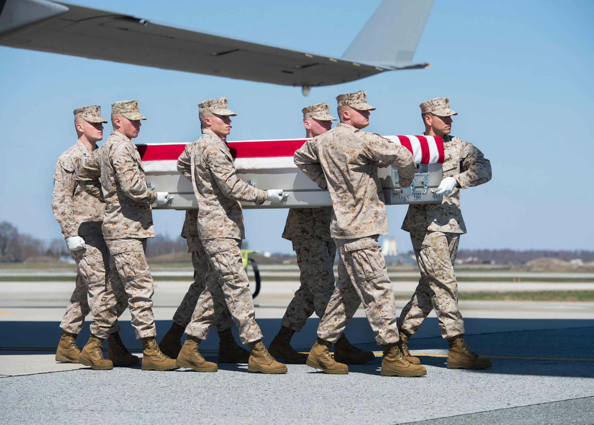 A U.S. Marine Corps carry team transfers the remains of Staff Sgt. Louis F. Cardin of Temecula, Calif., March 21, 2016, at Dover Air Force Base, Del. Cardin was assigned to the 2nd Battalion, 6th Marine Regiment, 26th Marine Expeditionary Unit, Camp Lejeune, N.C. (U.S. Air Force photo/Senior Airman Class Zachary Cacicia)