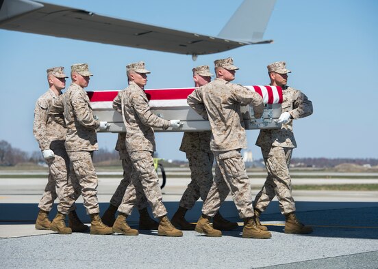 A U.S. Marine Corps carry team transfers the remains of Staff Sgt. Louis F. Cardin, of Temecula, Calif., during a dignified transfer March 21, 2016, at Dover Air Force Base, Del. Cardin was assigned to the 2nd Battalion, 6th Marine Regiment, 26th Marine Expeditionary Unit, Camp Lejeune, N.C. (U.S. Air Force photo/Senior Airman Zachary Cacicia)