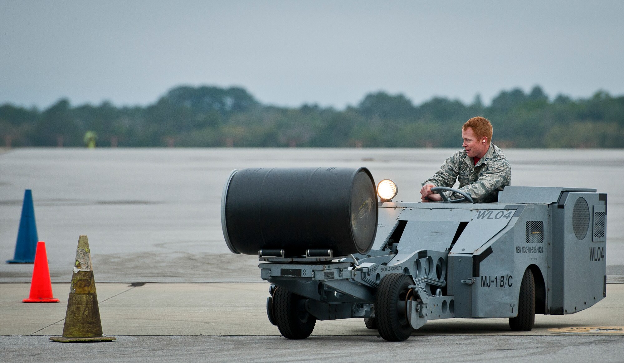 Capt. James Smith, 96th Aircraft Maintenance Squadron, steers into a turn during the “Jammer Jamboree” event March 18 at Eglin Air Force Base, Fla.  The jammer event was part of the first-ever Team Eglin weapons loadcrew competition.  Maintenance leadership from the 33rd Fighter Wing and the 96th Test Wing drove the vehicles, used to move and load weapons, through the course.  The 96th Test Wing won the event with the quickest time and fewest errors.  (U.S. Air Force photo/Samuel King Jr.)