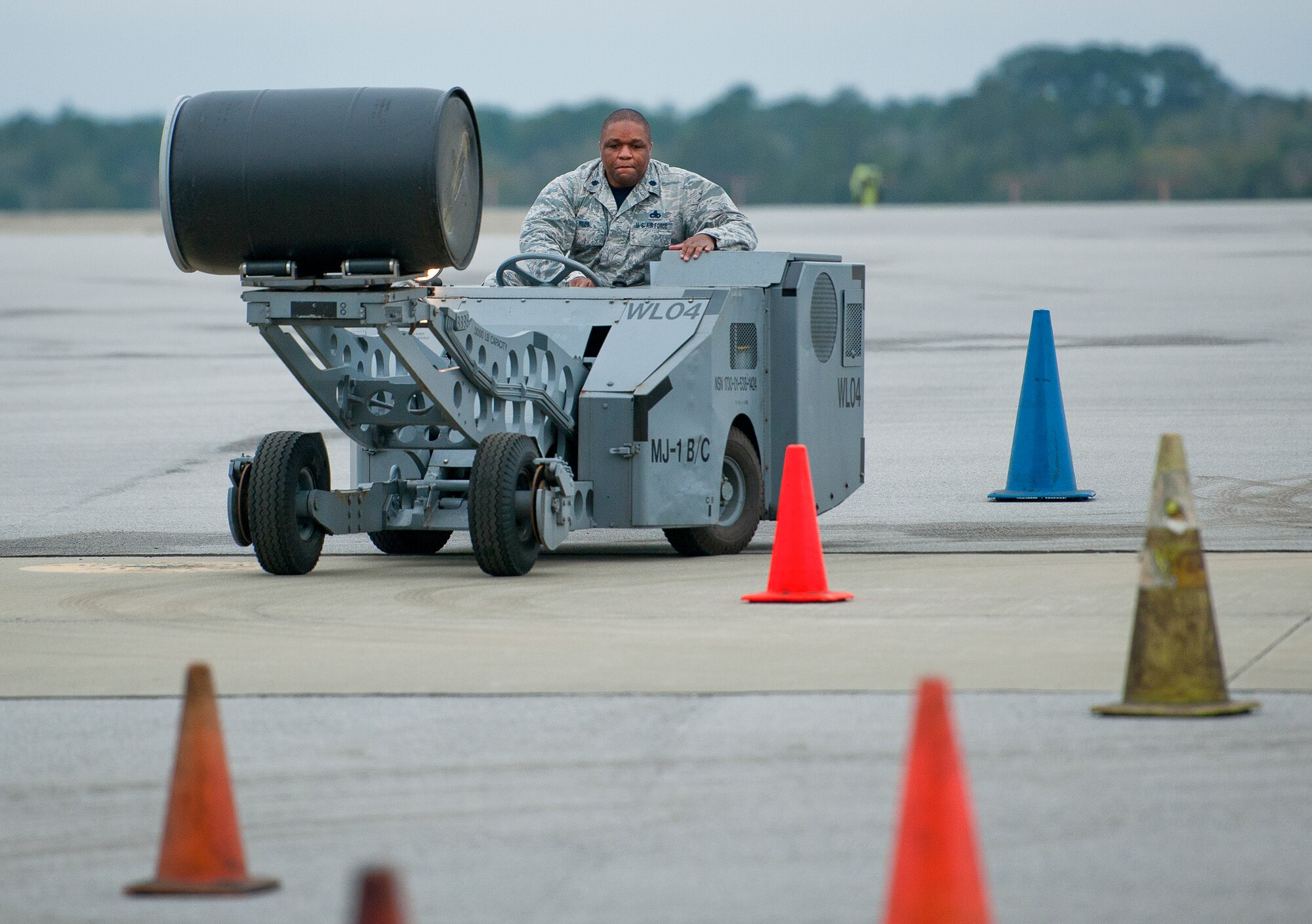 Lt. Col.  Roddrick Webb, 33rd Maintenance Group deputy commander, cruises through an obstacle course during the “Jammer Jamboree” event March 18 at Eglin Air Force Base, Fla.  The jammer event was part of the first-ever Team Eglin weapons loadcrew competition.  Maintenance leadership from the 33rd Fighter Wing and the 96th Test Wing drove the vehicles, used to move and load weapons, through the course.  The 96th Test Wing won the event with the quickest time and fewest errors.  (U.S. Air Force photo/Samuel King Jr.)