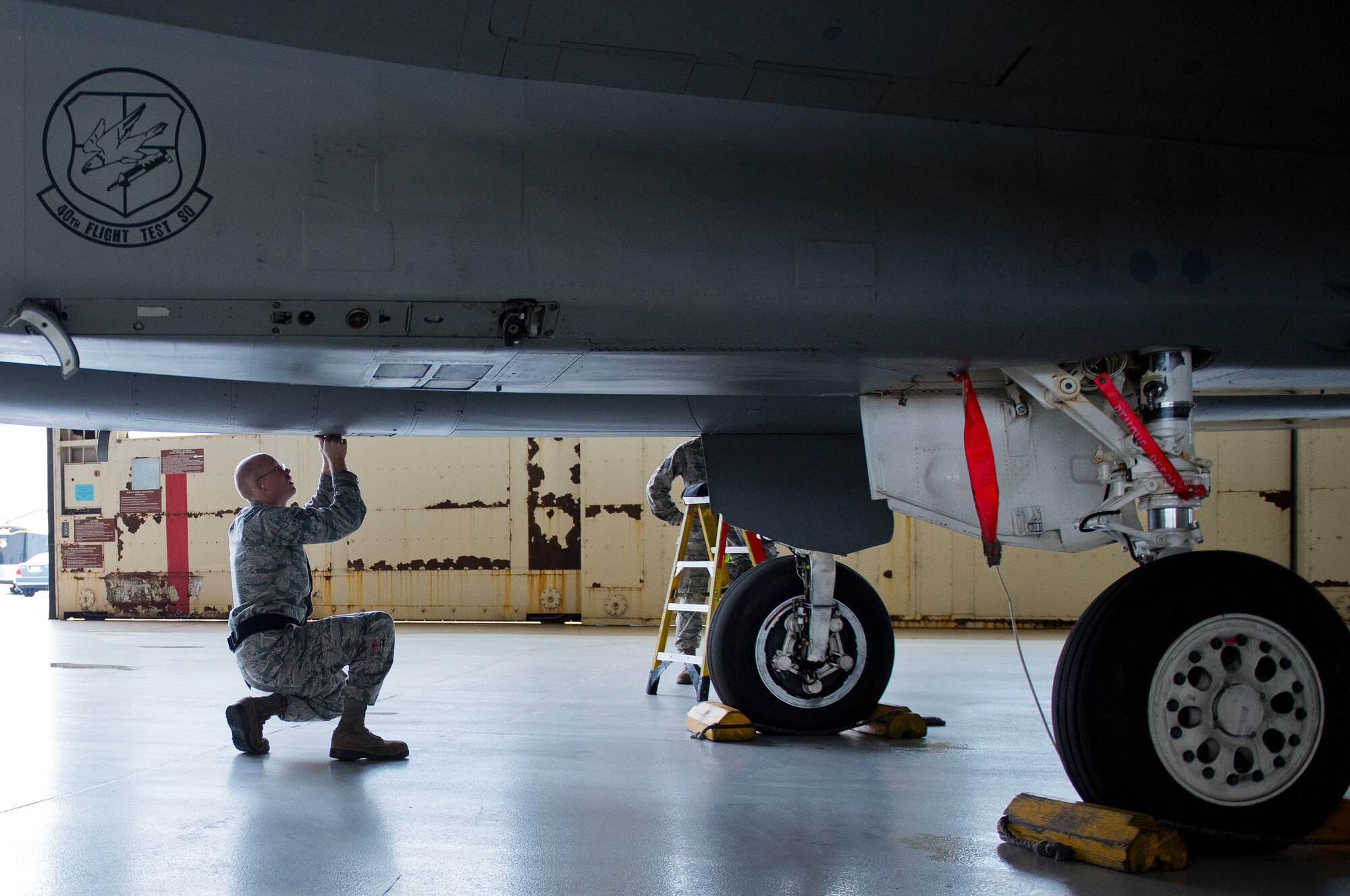 Staff Sgt. Tyler Marking, 96th Aircraft Maintenance Unit Red, performs checks on his aircraft after his team loaded two AIM-120 missiles onto their F-15 Eagle March 18 at Eglin Air Force Base, Fla.  The timed load was part of the first-ever Team Eglin weapons load competition pitting the 33rd Fighter Wing against the 96th Test Wing.  The 33rd FW won the first of what is to become a yearly competition.  (U.S. Air Force photo/Samuel King Jr.)