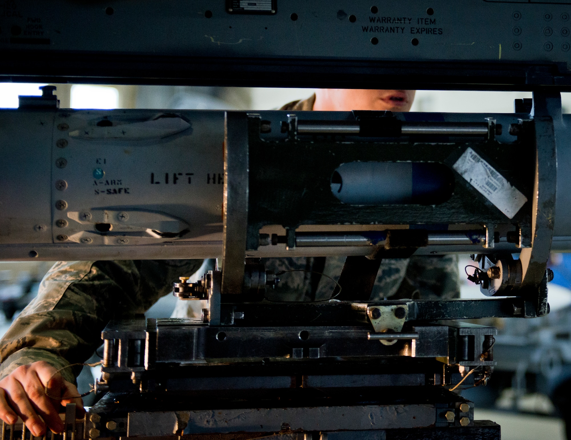 Staff Sgt. Steven Guiette, 96th Aircraft Maintenance Unit Blue, lines up an AIM-120 missile to be loaded onto the F-16 Fighting Falcon’s wing March 18 at Eglin Air Force Base, Fla.  The timed load was part of the first-ever Team Eglin weapons load competition pitting the 33rd Fighter Wing against the 96th Test Wing.  The 33rd FW won the first of what is to become a yearly competition.  (U.S. Air Force photo/Samuel King Jr.)