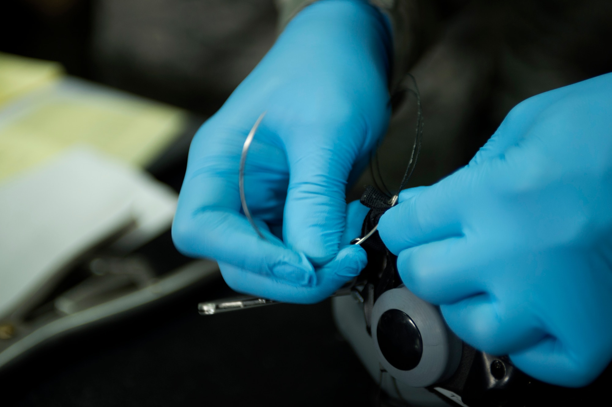 U.S. Air Force Staff Sgt. Kevin Ray, a 74th Expeditionary Fighter Squadron aircrew flight equipment technician from the 23rd Operations Support Squadron at Moody Air Force Base, Ga., sews a tightened strap on a breathing mask during the 74th EFS’s deployment in support of Operation Atlantic Resolve at Graf Ignatievo, Bulgaria, March 16, 2016. The mask had been used as a breathing apparatus for 74th EFS pilots who were participating in the deployment to Eastern Europe.  (U.S. Air Force photo by Staff Sgt. Joe W. McFadden/Released)