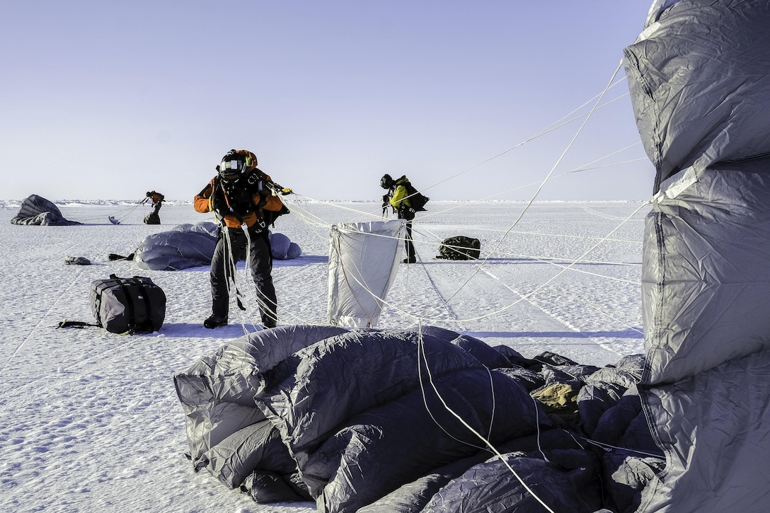 Combat rescue officers and pararescuemen arrive to deliver supplies during Ice Exercise 2016 on Ice Camp Sargo, a temporary station on an ice floe in the Arctic Ocean, March 15, 2016, The U.S. Navy and other U.S. and partner-nation organizations are conducting the five-week exercise to research, test and evaluate operational capabilities in the region. Navy photo by Petty Officer 2nd Class Zachary Yanez