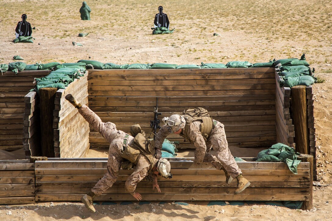Marines practice diving for safety during an M67 fragmentation grenade training range in Southwest Asia, March 9, 2016. The Marines are assigned to Charlie Company, 1st Battalion, 7th Marine Regiment, Special Purpose Marine Air-Ground Task Force-Crisis Response-Central Command. Marine Corps photo by Cpl. Akeel Austin