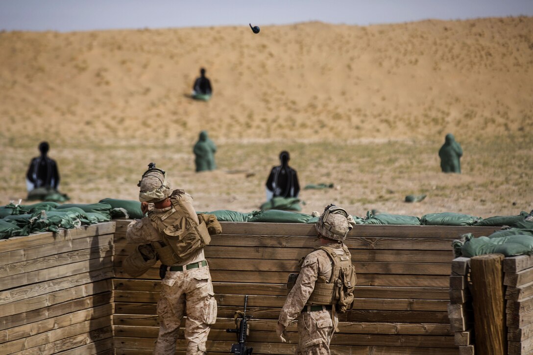 A Marine throws an M67 fragmentation grenade during a training event at a range in Southwest Asia, March 9, 2016. Marine Corps photo by Cpl. Akeel Austin