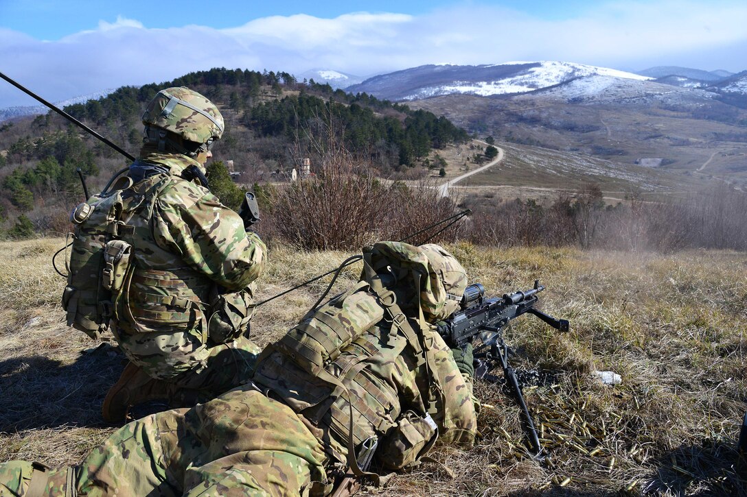 Army Spc. Fernando Jimenez, right, engages a target with a machine gun during a live-fire event as part of Exercise Rock Sokol at Pocek Range in Postonja, Slovenia, March 9, 2016. Jimenez is a paratrooper assigned to the 2nd Battalion, 503rd Infantry Regiment, 173rd Airborne Brigade Combat Team. Army photo by Paolo Bovo