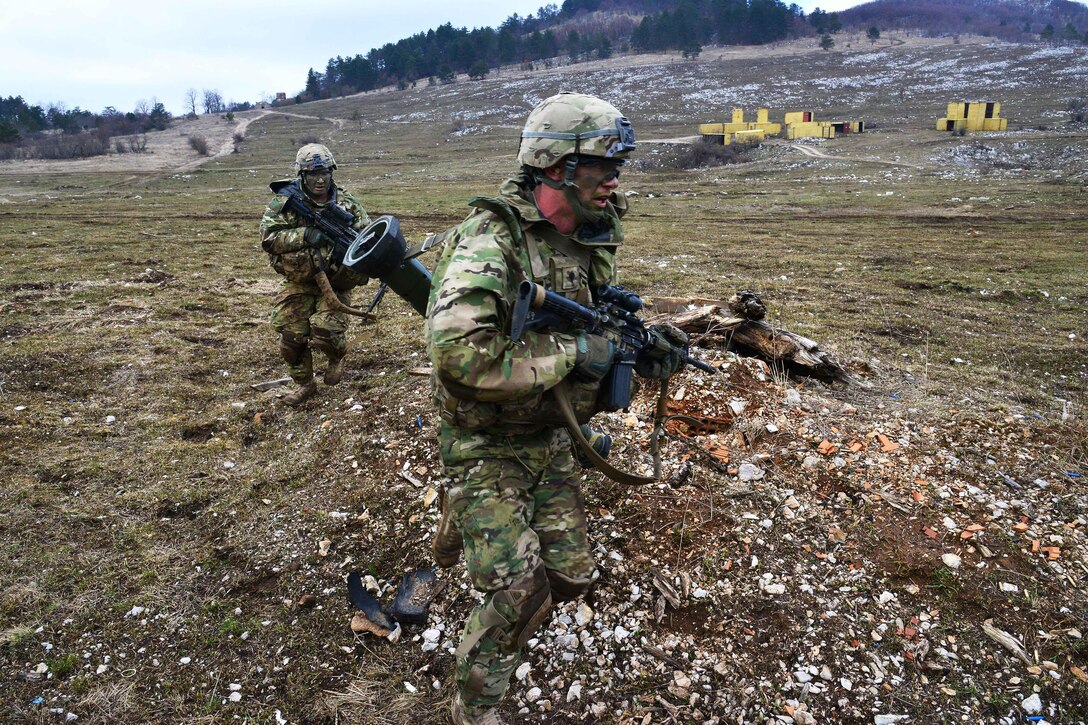 U.S. soldiers advance forward toward their next objective during a live-fire exercise as part of Exercise Rock Sokol at Pocek Range in Postonja, Slovenia, March 9, 2016. Army photo by Paolo Bovo