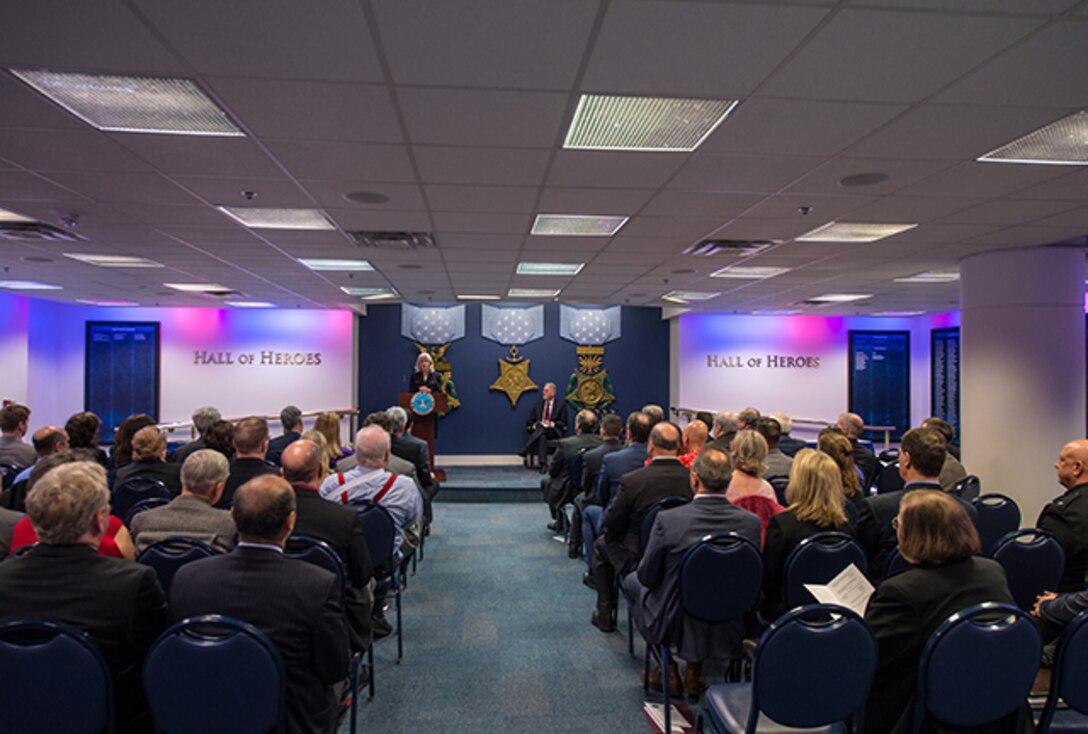 Ms. Kristen J. Baldwin, acting deputy assistant secretary of defense, systems engineering (at podium) and Mr. Gregory E. Saunders, director of the Defense Standardization Programs Office host a ceremony honoring recipients of the DSP Achievement Awards in the Hall of Heroes at the Pentagon, March 16, 2016.