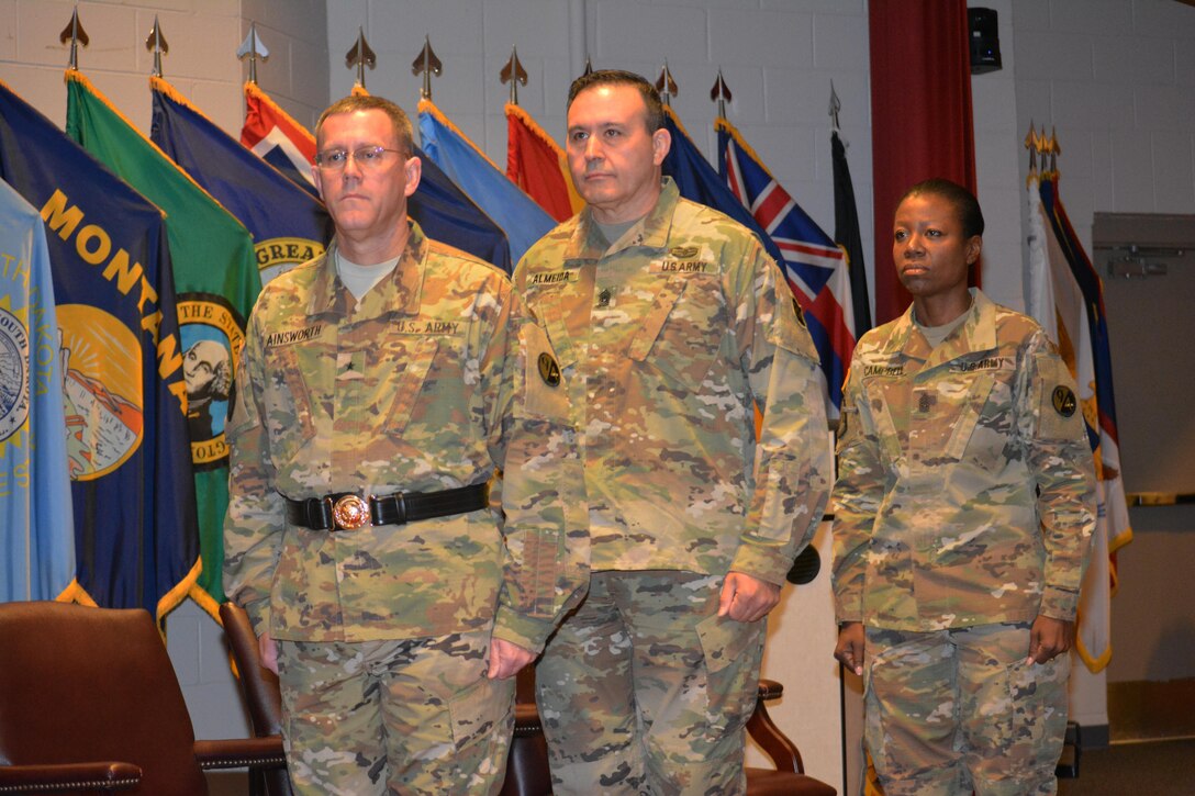 From left to right, Brig. Gen. Steven W. Ainsworth, the 94th Training Division commander, Command Sgt. Maj. Arlindo Almeida, outgoing senior noncommissioned officer, 94th TD and Command Sgt. Maj. Sharon Campbell, the 94th TD’s new command sergeant major, during a change or responsibility ceremony, where Campbell became the division’s first female command sergeant major March 18, 2016.