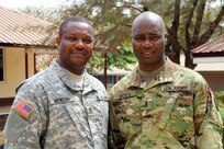 Active Guard Reserve Sgt. 1st Class Solomon Mensah, a member of Medical Readiness Training Exercise 16-2 command and control team and pay agent from the 3rd Medical Command (Deployment Support) unit at Fort Gillem, Ga., poses with 1st Lt. Frank Goka, a mobilized Army Reserve Soldier assigned to Fort Hood, Texas, participated in MEDRETE 16-2, from Feb. 3-26, at the 37 Military Hospital, Accra, Ghana. Both Mensah and Goka are originally from Ghana. Mensah and Goka were essential to MEDRETE 16-2 with helping the U.S. medical team establish relationships amongst the Ghanaian Defense Force and medical professionals at the 37 Military Hospital. (U.S. Army Africa photo by Maj. Satomi Mack-Martin)