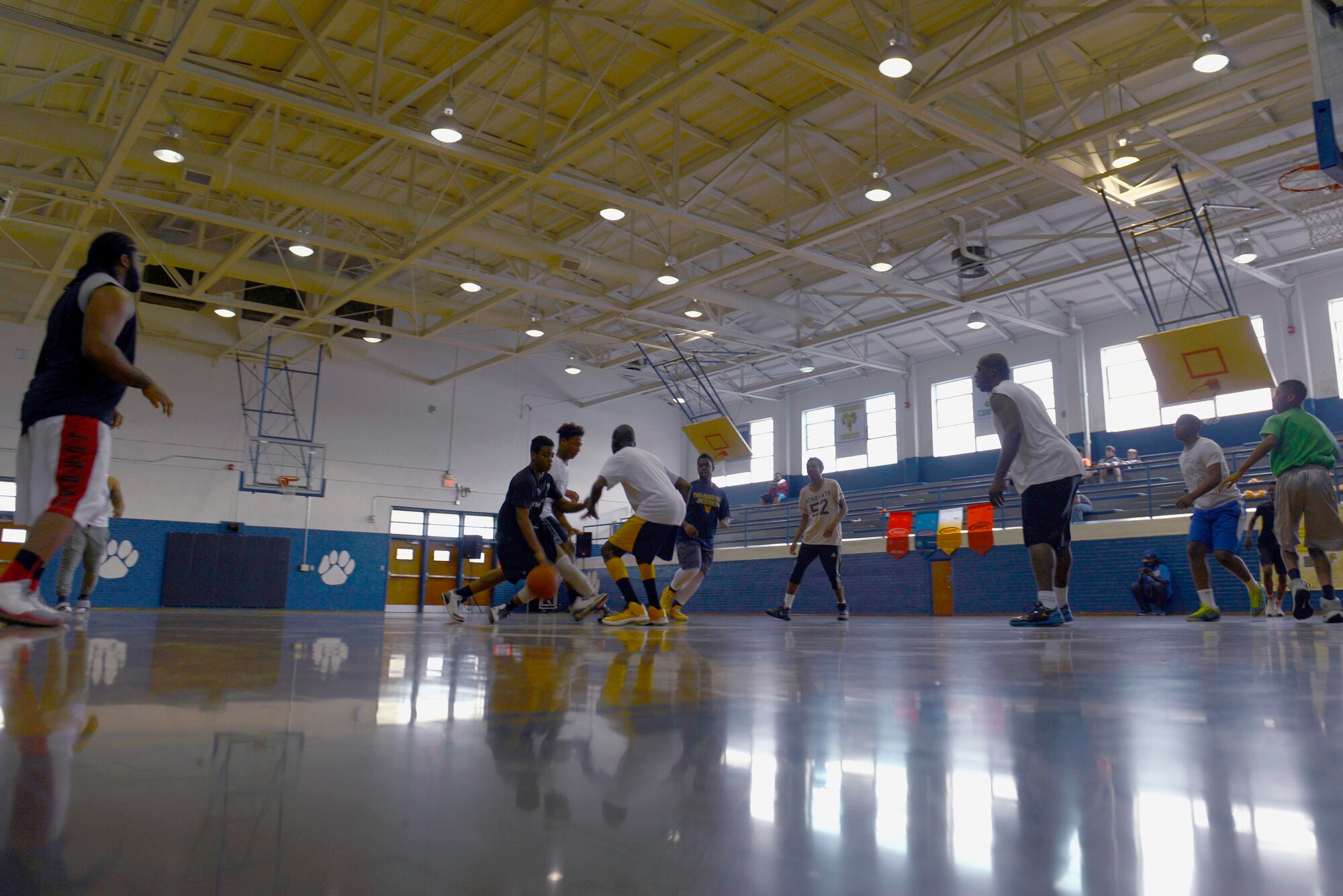 Members of the Wayne County community play basketball, March 19, 2016, at Dillard Middle School in Goldsboro, North Carolina. Team Seymour Airmen worked with the community to set up a basketball tournament between local community teams and Airmen. (U.S. Air Force photo/Airman 1st Class Ashley Williamson)
