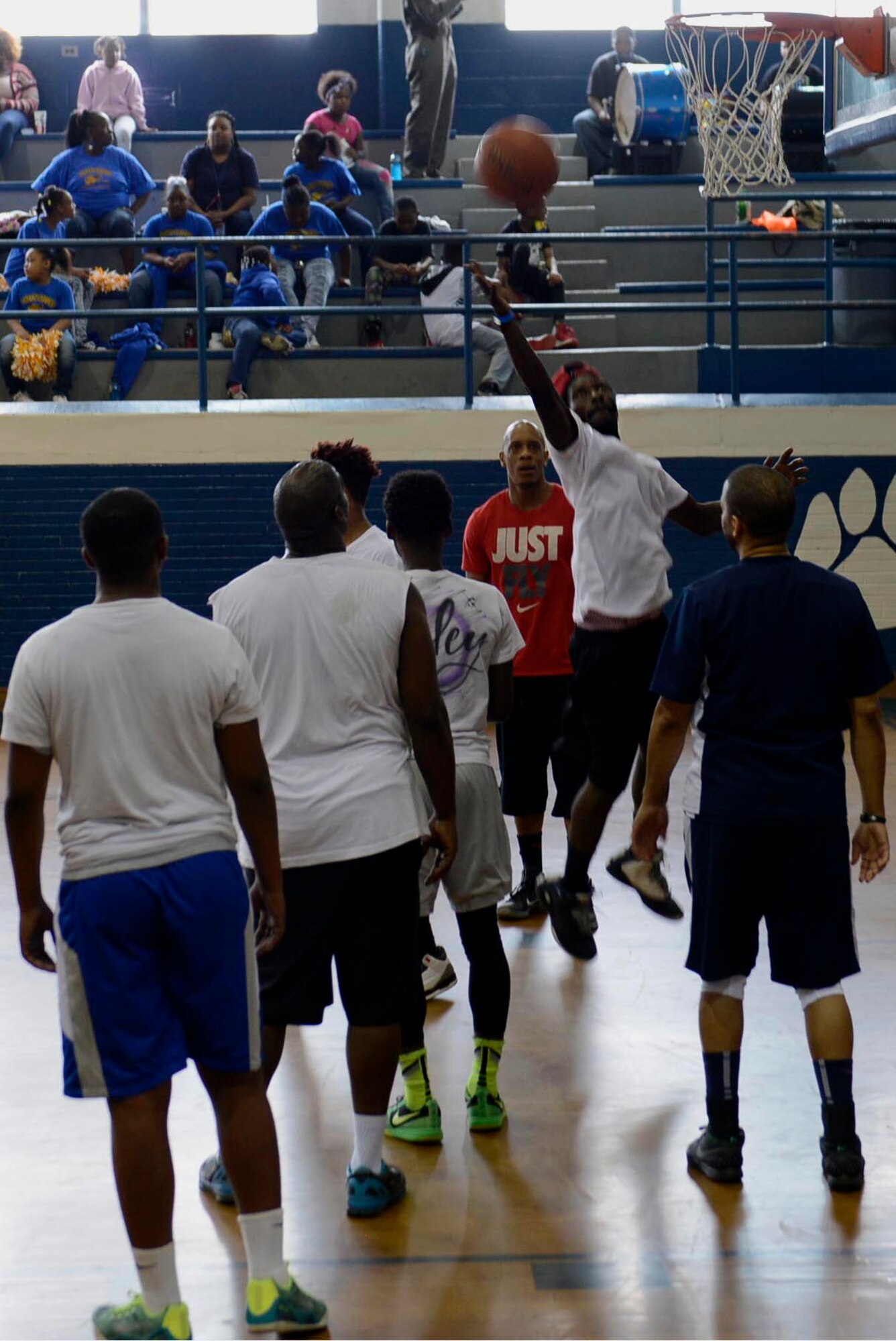 Wayne County community members compete in a basketball tournament with Seymour Johnson Air Force Base, North Carolina Airmen, March 19, 2016, at Dillard Middle School in Goldsboro, North Carolina. The middle school band and cheerleaders entertained the crowd during halftime by playing songs and dancing.  (U.S. Air Force photo/Airman 1st Class Ashley Williamson)