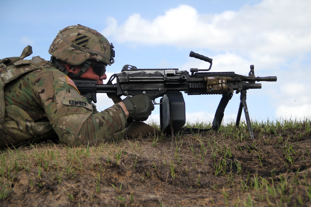 A soldier provides security with an M249 squad automatic weapon machine gun during a training exercise at Fort Stewart, Ga., March 10, 2016. Army photo by Pfc. Payton Wilson
