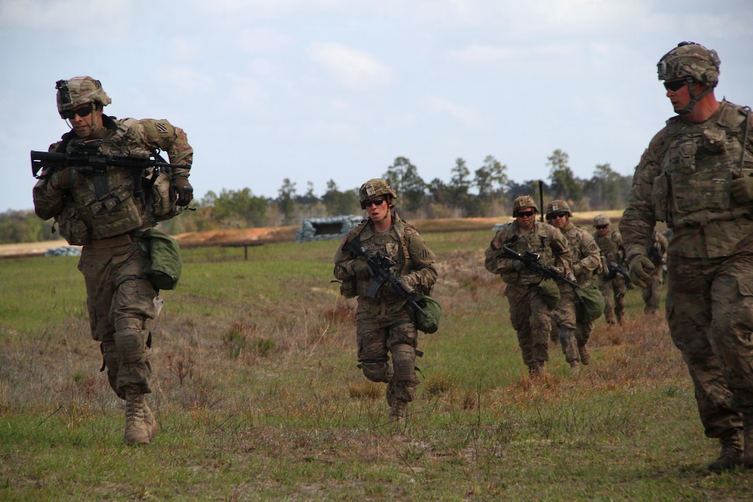 Soldiers advance toward their next objective during a training exercise at Fort Stewart, Ga., March 10, 2016. Army photo by Pfc. Payton Wilson