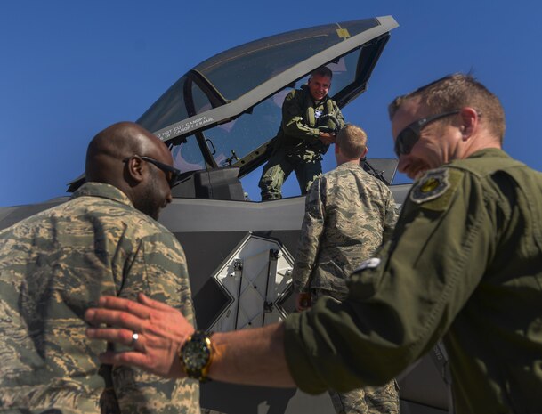 Maj. Gen. Jay Silveria, United States Air Force Warfare Center commander, is greeted by friends and family as he exits the cockpit of an F-35A Lightning II after his final flight at Nellis Air Force Base, Nev., March 10, 2016. Silveria is a command pilot with more than 3,800 hours in the T-37, T-38 and F-15C/E, HH-60 and F-35A aircraft. (U.S. Air Force photo by Airman 1st Class Kevin Tanenbaum)