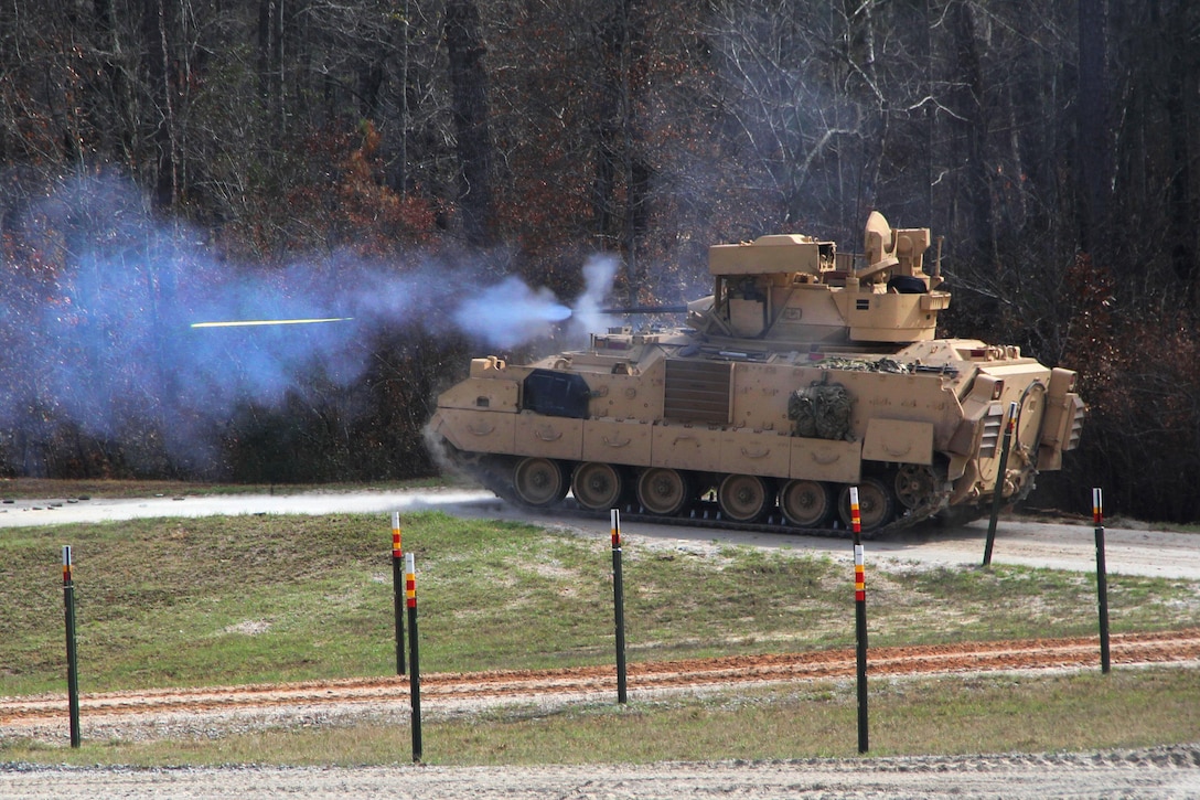 Soldiers manning a M3A3 Bradley fighting vehicle fire an M242 25mm Bushmaster chain gun during a live-fire training exercise at Fort Stewart, Ga., March 10, 2016. The soldier is assigned to the 3rd Infantry Division’s Company A, 2nd Battalion, 7th Infantry Regiment, 1st Armored Brigade Combat Team. Army photo by Pfc. Payton Wilson