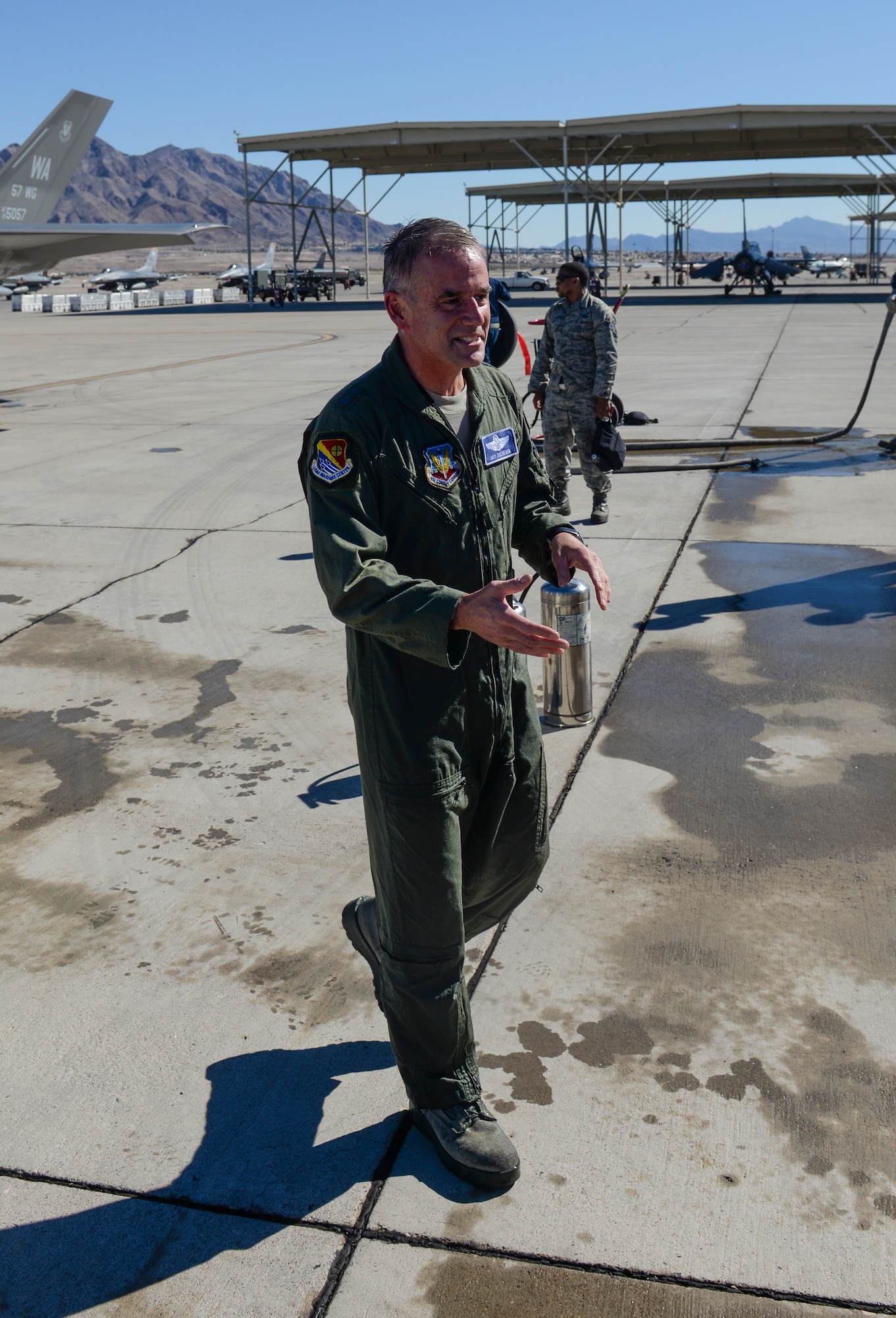 Maj. Gen. Silveria, United States Air Force Warfare Center commander, greets friends and family after his final flight at Nellis Air Force Base, Nev., March 10, 2016. Silveria has been commander of the U.S Air Force Warfare Center since February 2014. (U.S. Air Force photo by Airman 1st Class Nathan Byrnes)