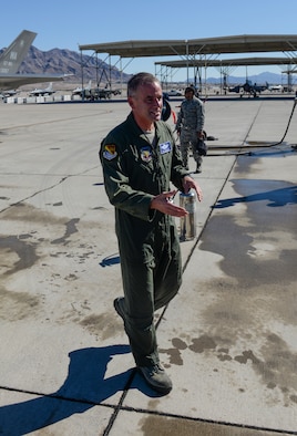 Maj. Gen. Silveria, United States Air Force Warfare Center commander, greets friends and family after his final flight at Nellis Air Force Base, Nev., March 10, 2016. Silveria has been commander of the U.S Air Force Warfare Center since February 2014. (U.S. Air Force photo by Airman 1st Class Nathan Byrnes)