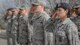 Altus Airman Leadership School Class 16-D students salute the colors as it is lowered during a retreat ceremony at Vance Air Force Base, Oklahoma, March 14. In a nod to Air Force custom, ALS students are required to complete a retreat ceremony as part of their Airmanship tasks. In a cooperation with Altus Air Force Base, Altus ALS instructors commonly travel to Vance to teach classes that are predominantly made up of Vance Airmen, saving the Air Force approximately $30 thousand per class in travel costs. (U.S. Air Force photo by David Poe)