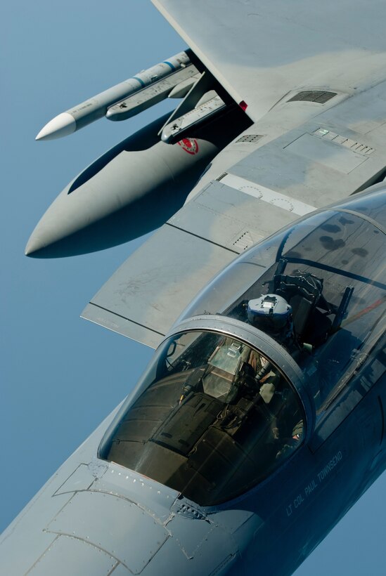 A U.S. Air Force F-15C Eagle fighter pilot with the 44th Fighter Squadron conducts an inflight refueling exercise with a KC-135 Stratotanker from the 909th Air Refueling Squadron, March 21, 2016, off the coast of Japan. With around-the-clock tanker support, U.S. and coalition forces can conduct long-range air operations for an indefinite amount of time in order to carry out aerial support and theater security throughout the Indo-Asia-Pacific region.  (U.S. Air Force photo by Senior Airman Peter Reft/Released)