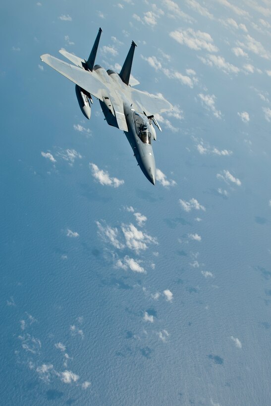 A U.S. Air Force F-15C Eagle aircraft with the 44th Fighter Squadron pulls away after completing inflight refueling, March 21, 2016, off the coast of Japan. 44th FS pilots maintain 24-hour readiness to provide regional security throughout the Indo-Asia-Pacific region night or day at a moment's notice. (U.S. Air Force photo by Senior Airman Peter Reft/Released)