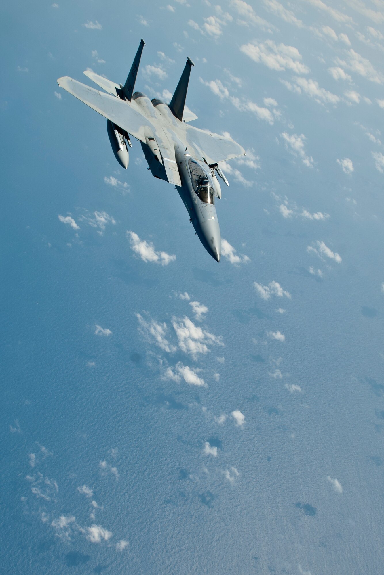 A U.S. Air Force F-15C Eagle aircraft with the 44th Fighter Squadron pulls away after completing inflight refueling, March 21, 2016, off the coast of Japan. 44th FS pilots maintain 24-hour readiness to provide regional security throughout the Indo-Asia-Pacific region night or day at a moment's notice. (U.S. Air Force photo by Senior Airman Peter Reft/Released)