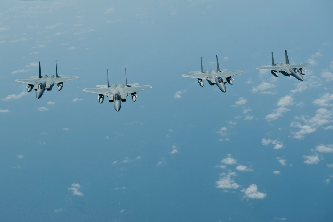 Four U.S. Air Force F-15C Eagle aircraft with the 44th Fighter Squadron fly in formation, March 21, 2016, off the coast of Japan. The F-15C is an all-weather, highly maneuverable tactical fighter that enables the Air Force to gain and maintain air supremacy over the battlefield. (U.S. Air Force photo by Senior Airman Peter Reft/Released)