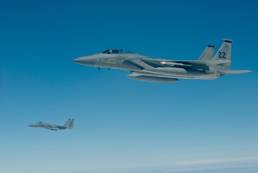 Two U.S. Air Force F-15C Eagle aircraft with the 44th Fighter Squadron fly in formation during an inflight refueling exercise, March 21, 2016, off the coast of Japan. 44th FS pilots carry out contingency operations and provide around-the-clock theater security throughout the Indo-Asia-Pacific region. (U.S. Air Force photo by Senior Airman Peter Reft/Released)
