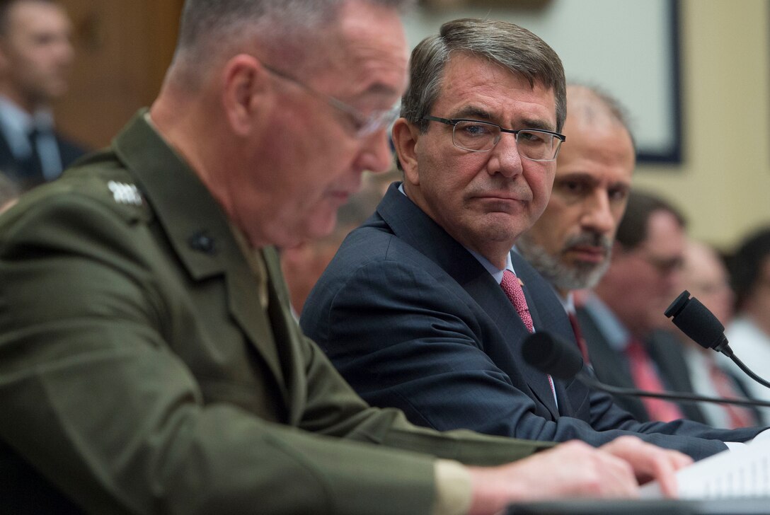 Defense Secretary Ash Carter, center, and Mike McCord, the Defense Department's comptroller, listen as Marine Corps Gen. Joseph F. Dunford Jr., chairman of the Joint Chiefs of Staff, testifies on the department's proposed fiscal year 2017 budget before the House Armed Services Committee in Washington, D.C., March 22, 2016. DoD photo by Air Force Senior Master Sgt. Adrian Cadiz
