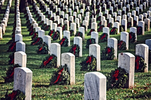 Thousands of volunteers placed approximately 230,000 evergreen wreaths at Arlington National Cemetery as part of the Wreaths Across America program on Dec. 13, 2015. The holiday tradition began in 1992 with 5,000 wreaths, and now has expanded to more than 1,000 fundraising groups in all 50 states, who place wreaths at hundreds of cemeteries and other military memorial sites across the country. 