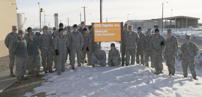 U.S. Airmen and Soldiers took a break from training for a group photo, March 1, 2016, at Eielson Air Force Base, Alaska. Airmen from the 354th Logistics Readiness Squadron fuels operations flight gave briefings on the different sections of the flight and how they differ from the Army’s fuels operations. (Courtesy  photo by U.S. Air Force Staff Sgt. William White/Released)
