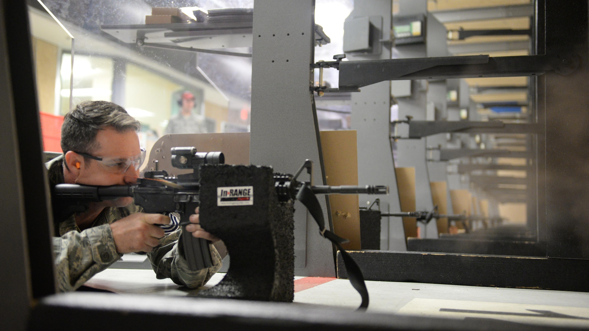 Tech. Sgt. Russell Smith, 366th Training Squadron, Detachment 6 structures instructor, Naval Construction Battalion Center, Gulfport, Miss., shoots a target with an M4 Carbine at the Combat Arms Training and Maintenance building March 9, 2016, Keesler Air Force Base, Miss. Before being deployed, Airmen must pass weapons qualifications with the M4 Carbine and be able to shoot from four positions – prone supported, prone unsupported, kneeling supported and over barricade supported – and hit their target from as far as 300 meters away. (U.S. Air Force photo by Airman 1st Class Travis Beihl)